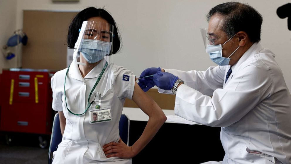 PHOTO: A medical worker receives a dose of the coronavirus vaccine as the country launches its inoculation campaign, in Tokyo, Feb. 17, 2021.