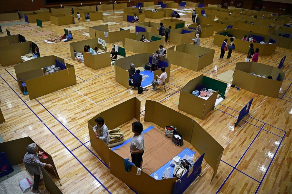 PHOTO: Local residents take shelter at an evacuation centre with space to maintain social distance in Yatsushiro city general gymnasium, Kumamoto prefecture, Japan, on July 6, 2020.