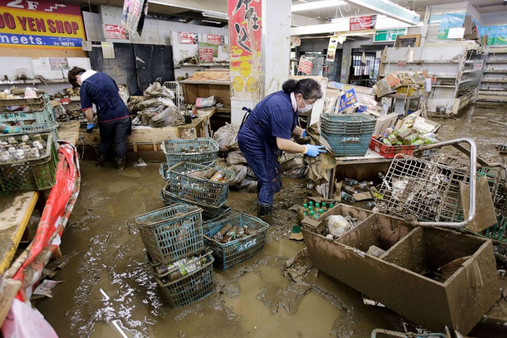 PHOTO: Staff members work to clean a supermarket in the aftermath of a flood in Hitoyoshi, Kumamoto Prefecture, Kyushu island, Japan, July 9, 2020.