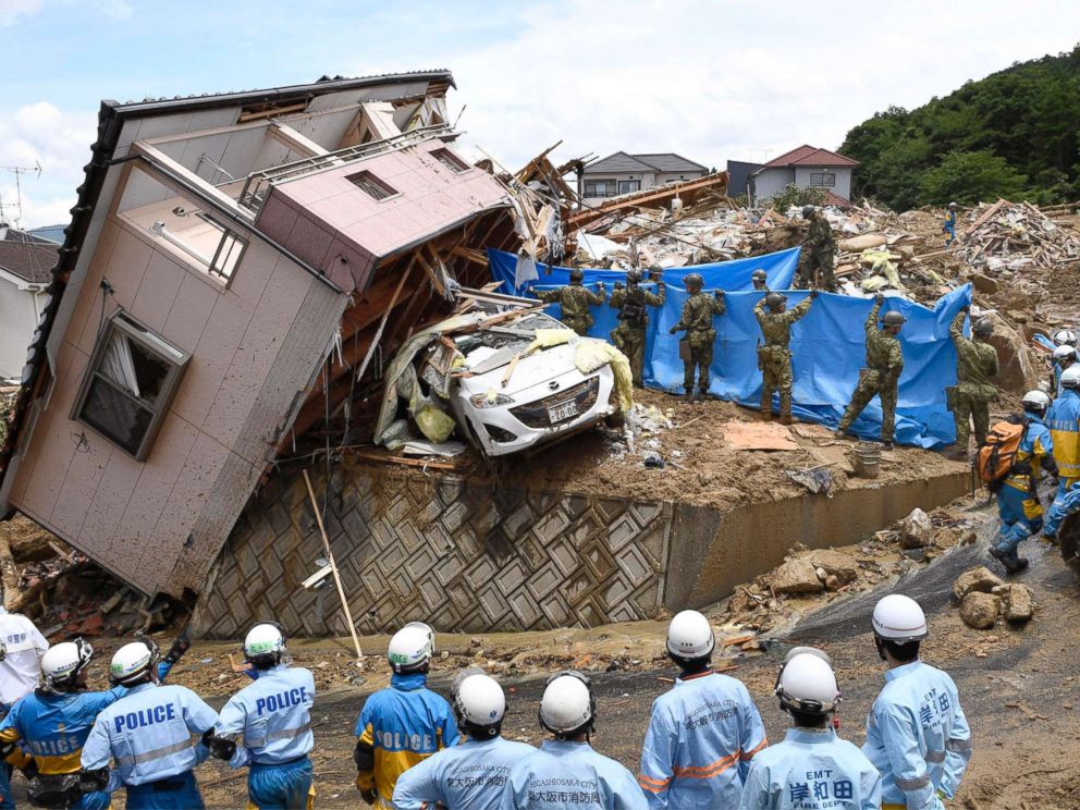 PHOTO: Rescuers conduct a search operation for missing persons in Kumano town, Hiroshima prefecture, western Japan Monday, July 9, 2018.
