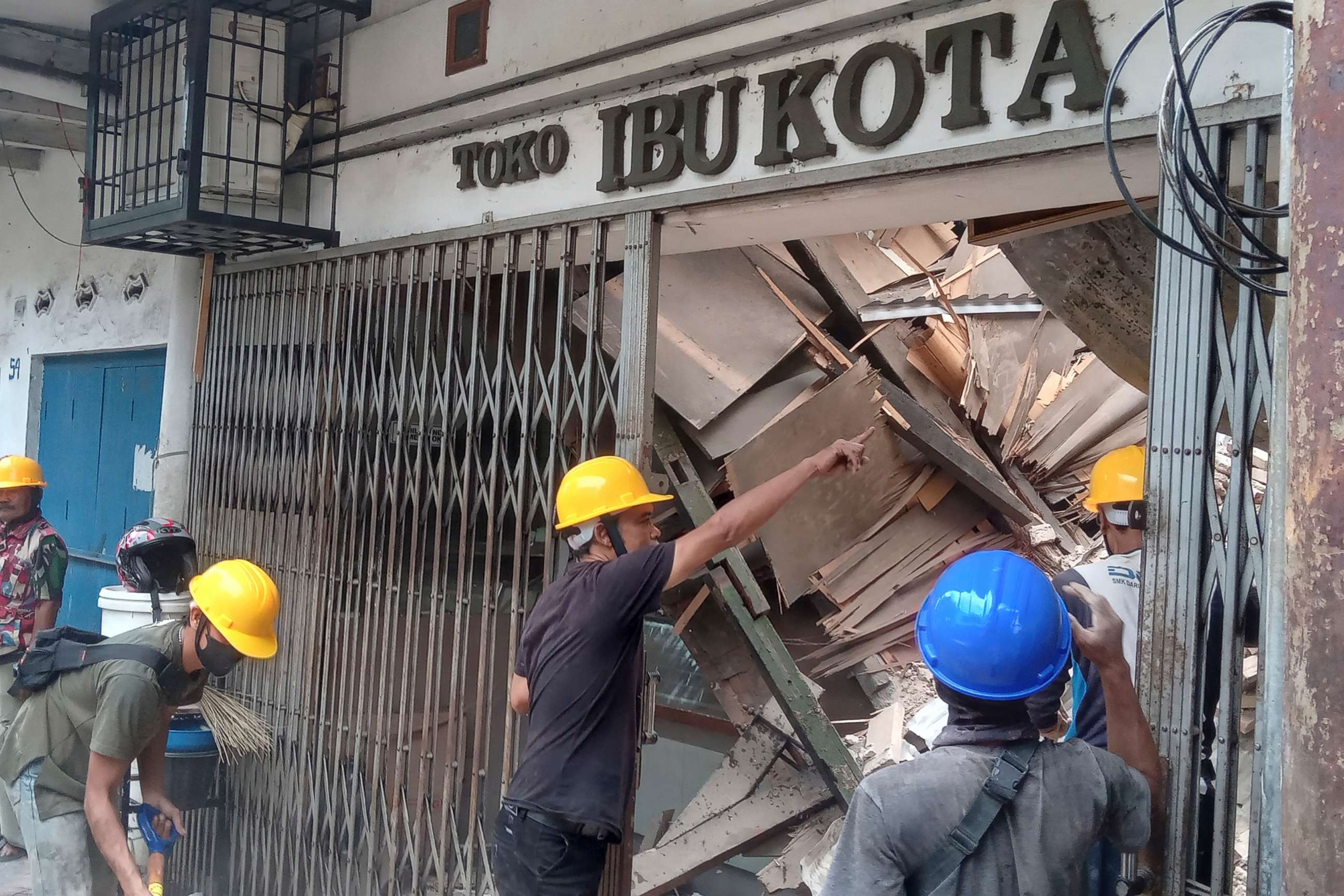 PHOTO: Workers inspect a store damaged during an earthquake in Cianjur, West Java, Indonesia, Nov. 21, 2022.