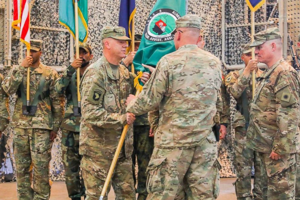 PHOTO: U.S. Army Maj. Gen. Andrew Poppas hands the Train, Advise and Assist Command-South colors to U.S. Army Brig. Gen. Jeffrey Smiley, June 30, 2018 during a Transfer of Authority ceremony in Kandahar, Afghanistan.