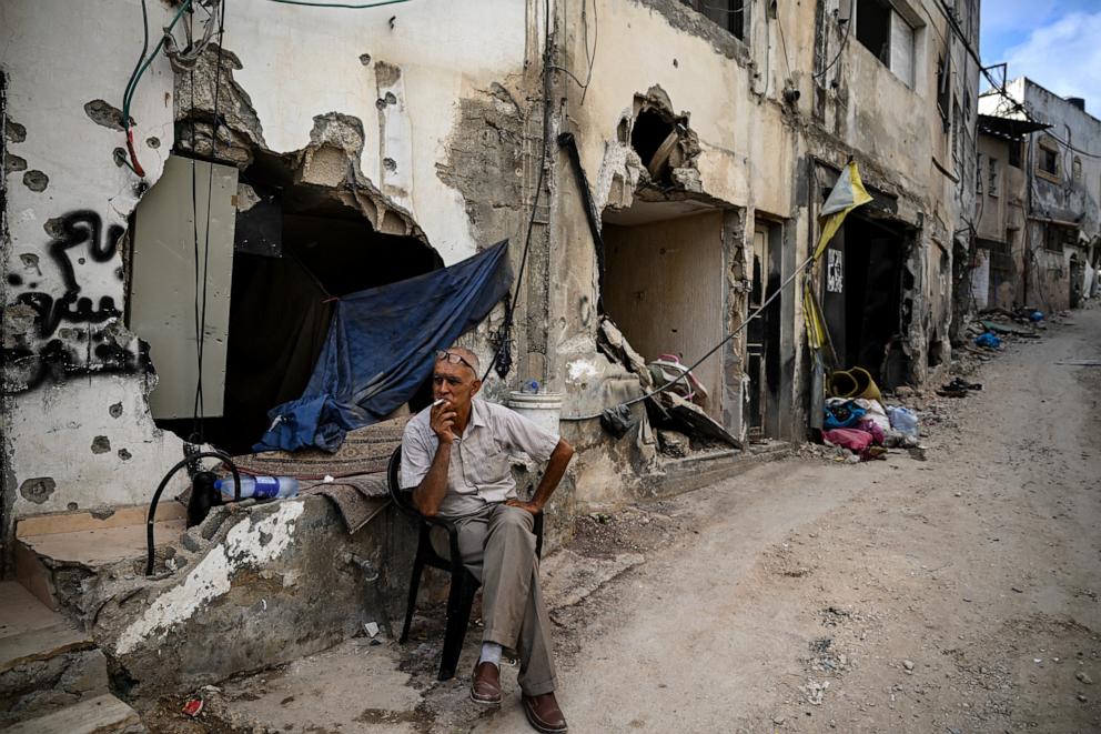 PHOTO: A man sits in front of a damaged building following an Israeli military raid in the Jenin refugee camp, in the occupied West Bank on Sept. 6, 2024.