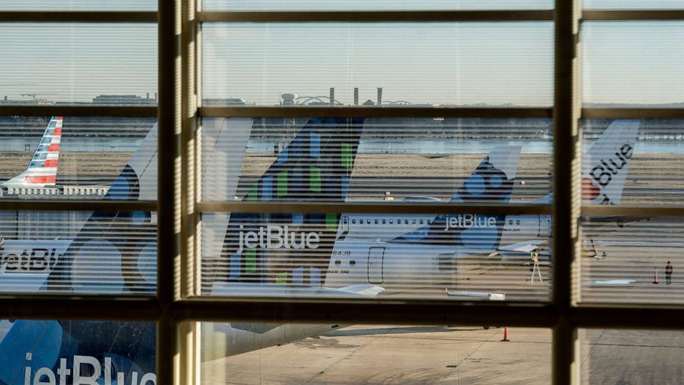 PHOTO: JetBlue Airlines planes sit on the tarmac at Ronald Reagan Washington National Airport in Arlington, Va, Jan. 30, 2022.