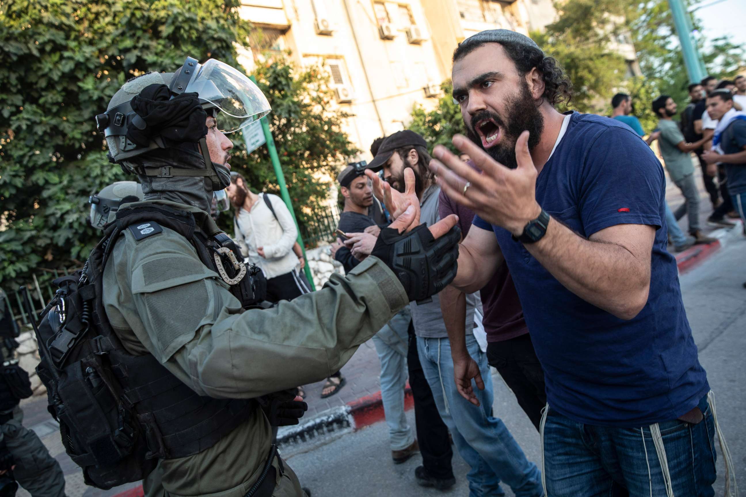 PHOTO: In this May 12, 2021, file photo, Israeli riot police tries to block a Jewish right-wing man as clashes erupted between Arabs, police and Jews, in the mixed town of Lod, central Israel.