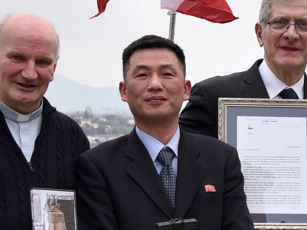 PHOTO: In this March 20, 2018 file photo the Parish of Farra di Soligo, shows North Koreas acting ambassador to Italy Jo Song Gil, center, holding a model of Bell of Peace of Rovereto during a cultural event in San Pietro di Feletto, Italy.