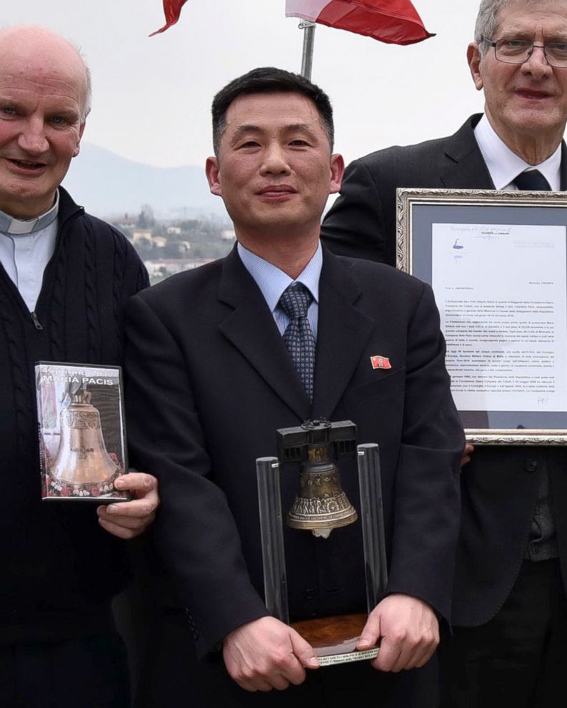 PHOTO: In this March 20, 2018 file photo the Parish of Farra di Soligo, shows North Korea's acting ambassador to Italy Jo Song Gil, center, holding a model of "Bell of Peace of Rovereto" during a cultural event  in San Pietro di Feletto, Italy.