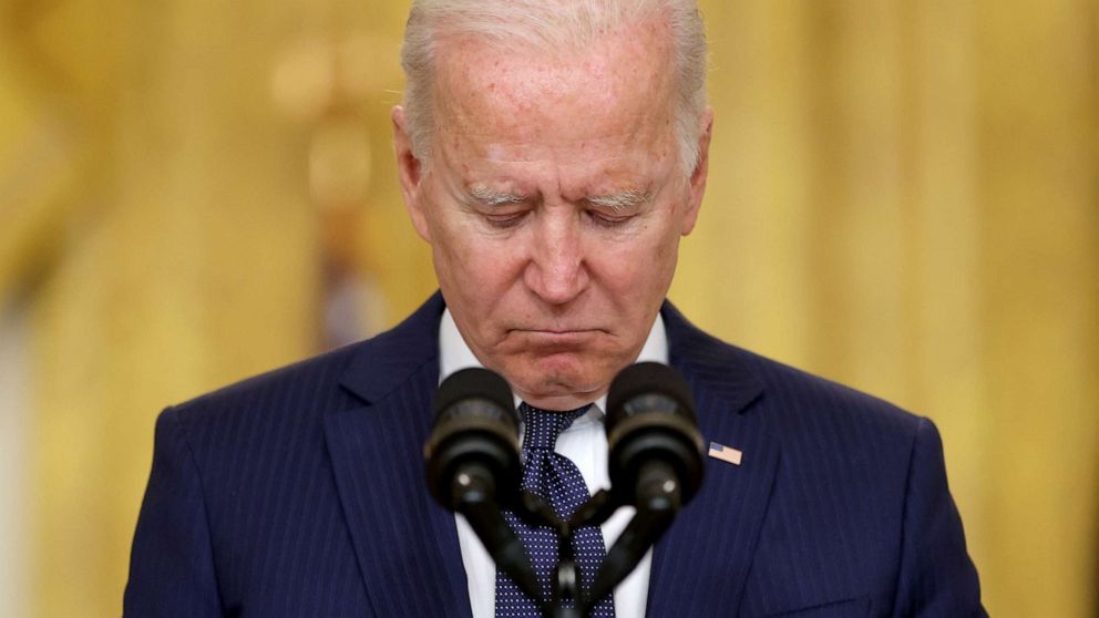PHOTO: President Joe Biden observes a moment of silence for the dead as he delivers remarks about Afghanistan after a deadly bombing in Kabul, from the East Room of the White House in Washington, Aug. 26, 2021.