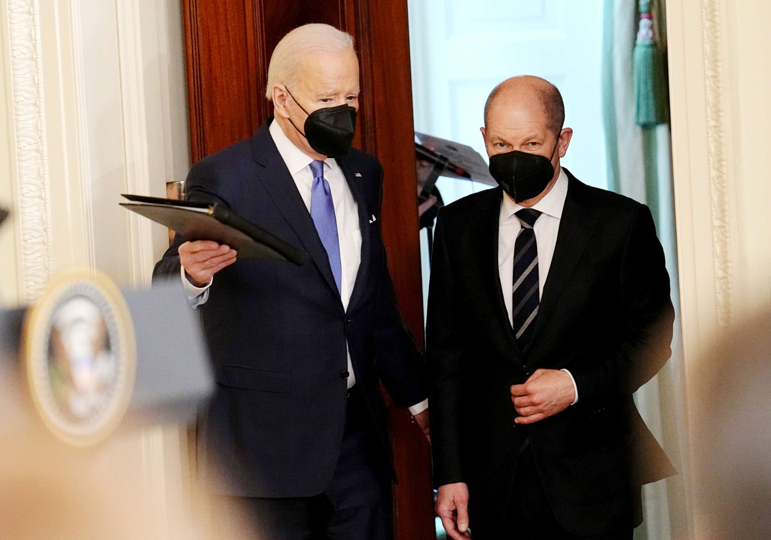 PHOTO: German Chancellor Olaf Scholz and US President Joe Biden arrive for a press conference at the White House, Feb. 7, 2022.