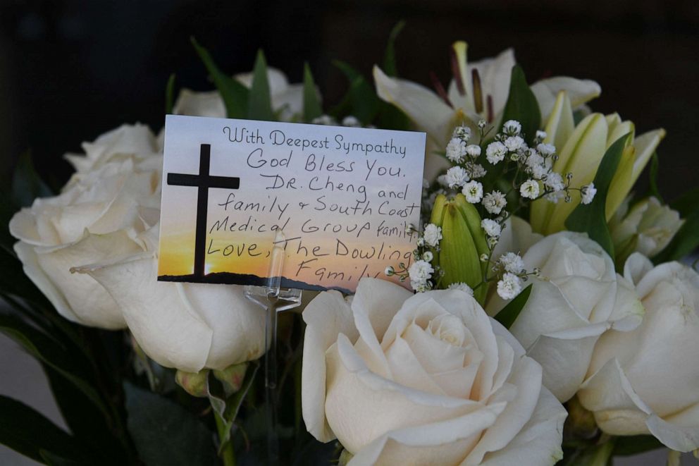 Flowers and a note are seen outside the office of Dr. John Cheng in Aliso Viejo, California, May 16, 2022. Cheng, 52,was killed protecting others when a gunman opened fire at church services he was attending in nearby Laguna Woods, Calif. on May 15, 2022.