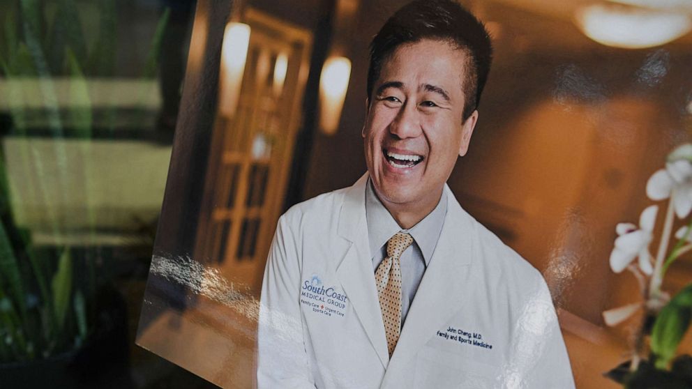 PHOTO: A photo of Dr. John Cheng is seen outside his office in Aliso Viejo, California, May 16, 2022, after he was killed protecting others when a gunman opened fire at church services he was attending in nearby Laguna Woods, Calif. on May 15, 2022.