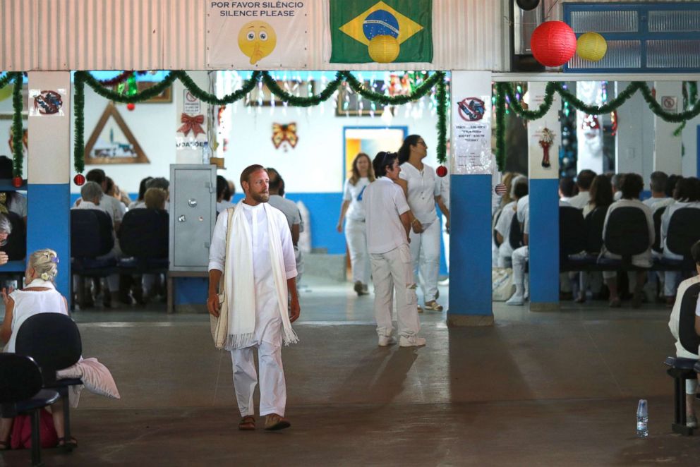  Followers of Brazilian spiritual healer Joao Teixeira de Faria, known as "John of God," are seen at his spiritual center in Abadiania, Brazil Dec. 13, 2018.
     