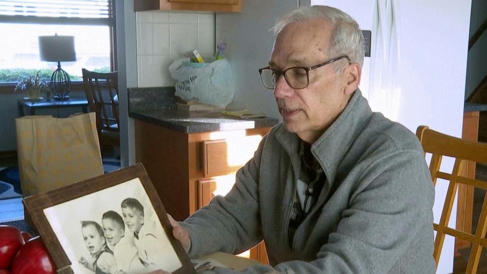 PHOTO: John Prevost points to an old photo of his brothers, including the newly elected Pope Leo XIV, Robert Prevost, left, during an interview with the Associated Press, May 8, 2025, in New Lennox, Ill.