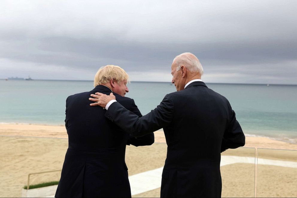 PHOTO: British Prime Minister Boris Johnson and President Joe Biden chat on June 11, 2021, ahead of the G7 Leaders' Summit in Carbis Bay, Cornwall, UK.
