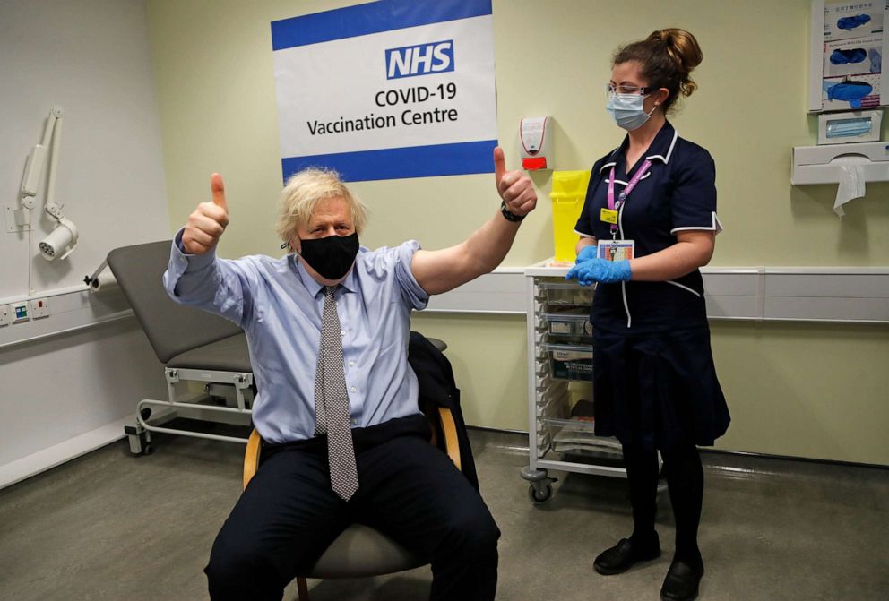 PHOTO: British Prime Minister Boris Johnson gestures after receiving the first dose of AstraZeneca's COVID-19 vaccine administered by a nurse at St.Thomas' Hospital in London, March 19, 2021.