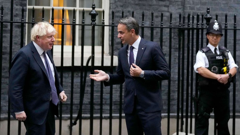 PHOTO: Britain's Prime Minister Boris Johnson, left, greets Greek Prime Minister Kyriakos Mitsotakis at Downing Street in London, Nov. 16, 2021.