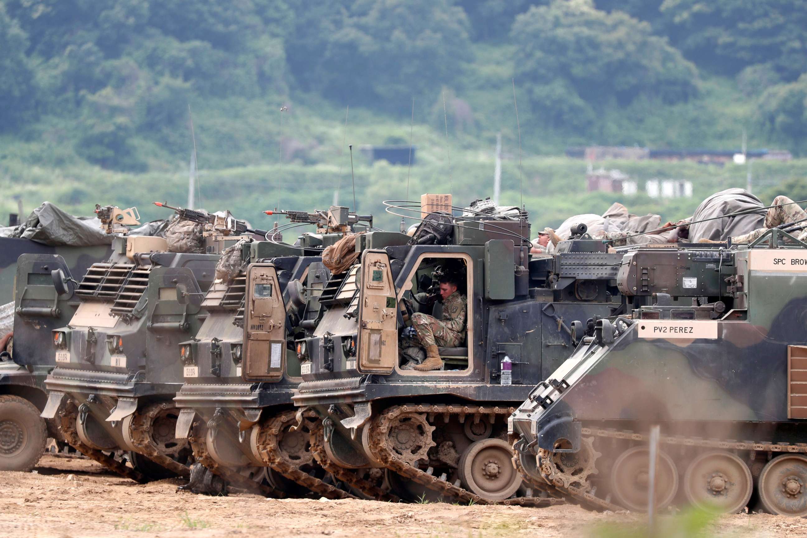 PHOTO: U.S. army personnel and multiple launch rocket systems participate in a defense exercise at the Mugeon-ri drill field near the Demilitarized Zone (DMZ) in Paju, Gyeonggi-do, South Korea, June 19, 2018.