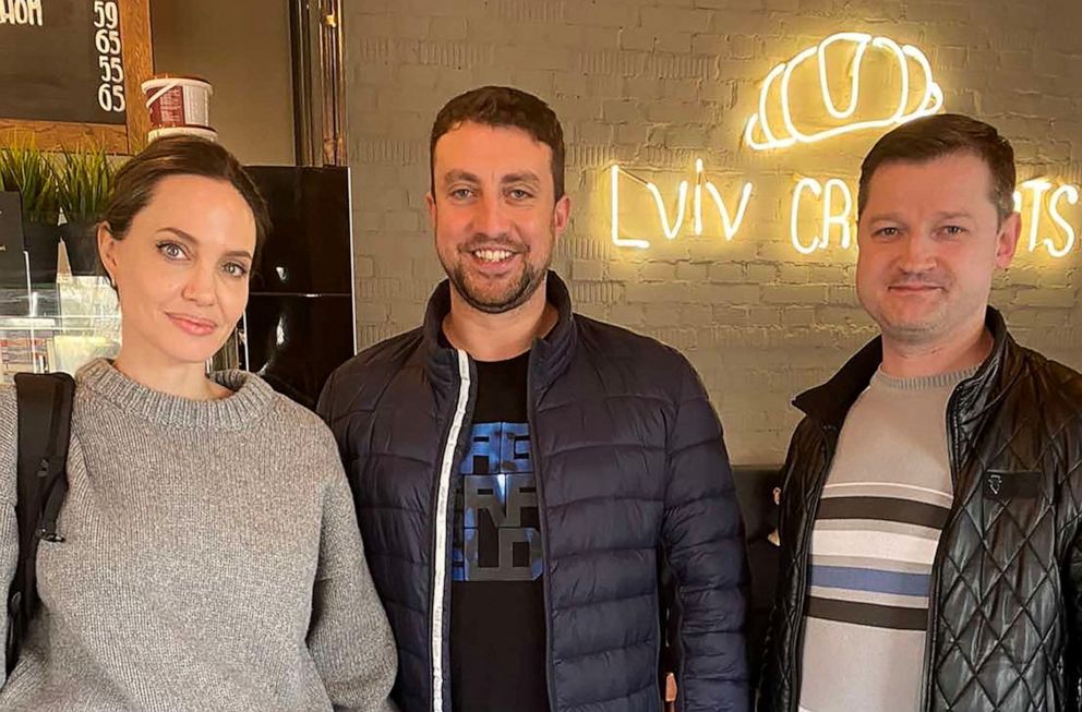 PHOTO: U.S. actor and UNHCR Special Envoy Angelina Jolie poses with Andriy Galickiy, founder of Lviv Croissants, during her visit to Lviv, amid Russia's invasion of Ukraine, April 30, 2022, in this handout image.
