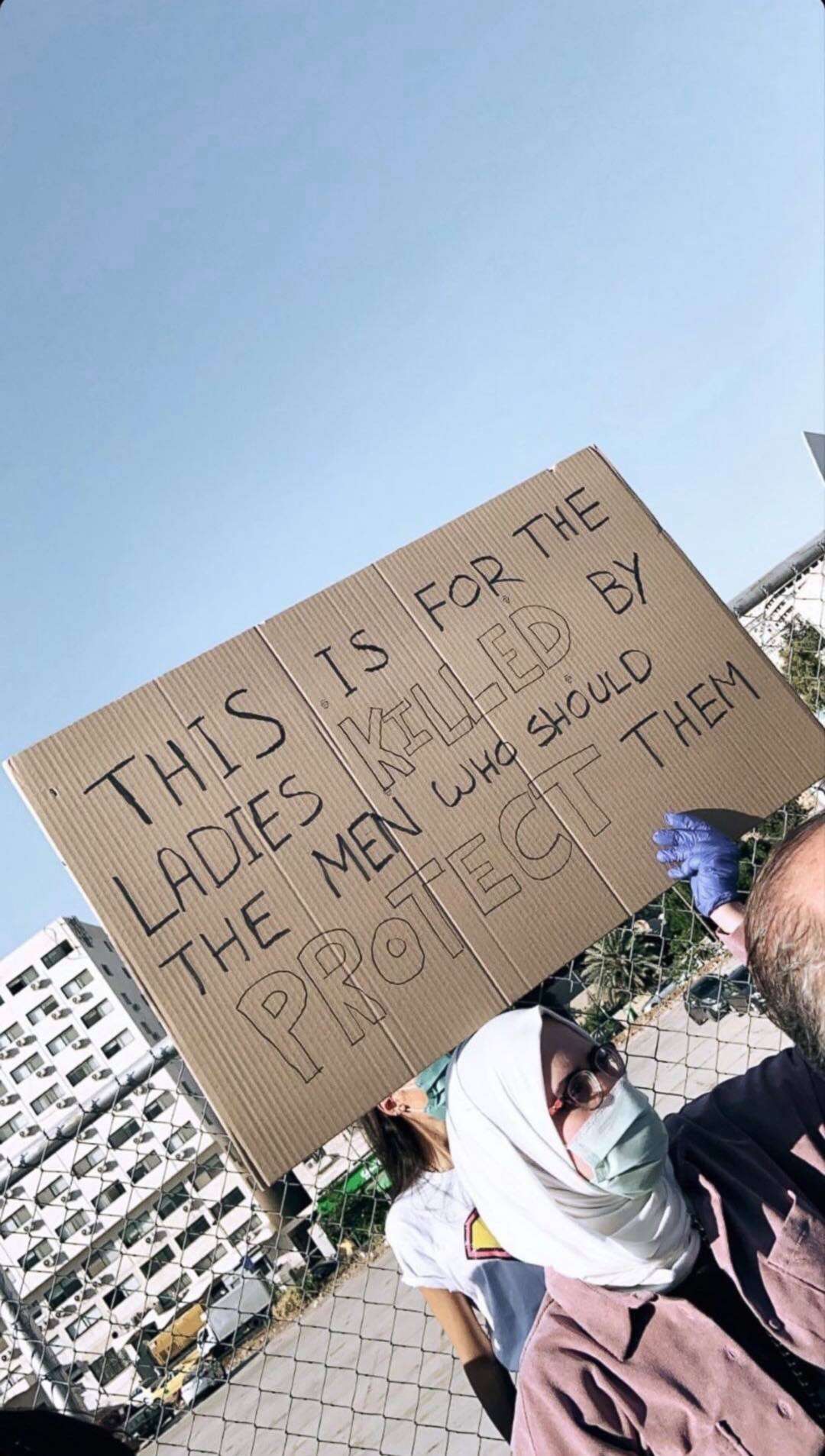 PHOTO: A protester holds a sign in front of the Jordanian Parliament building on July 22, 2020. 