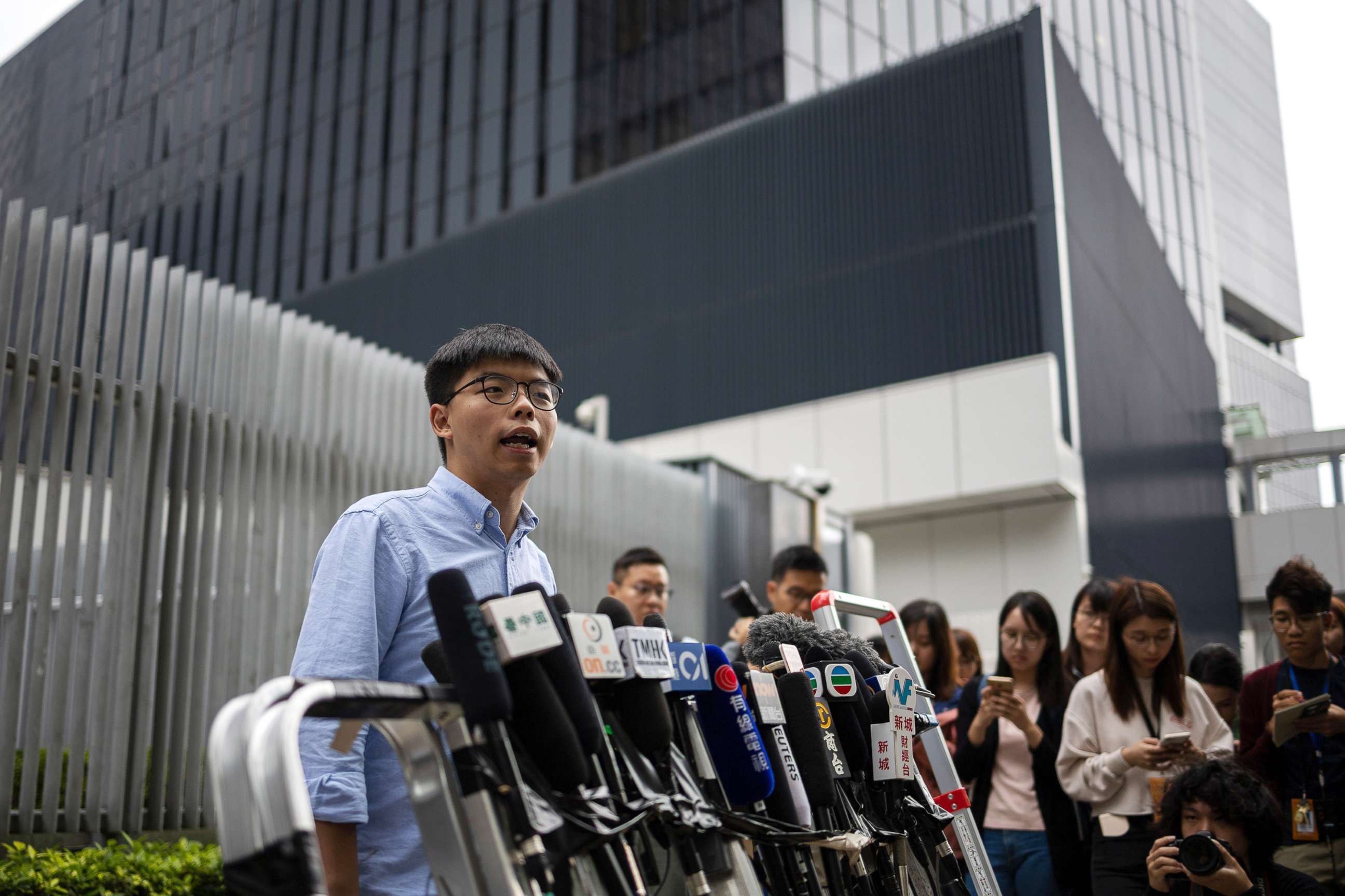 PHOTO: Pro-democracy activist and leader of Hong Kong's Demosisto party, Joshua Wong, left, speaks at a press conference outside the Legislative Council in Hong Kong, Oct. 29, 2019, after he was barred from running in the District Council Elections.