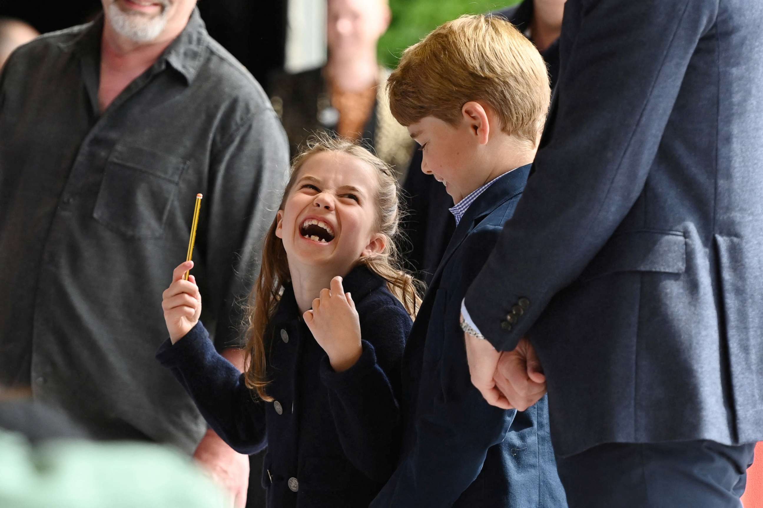 PHOTO: Princess Charlotte laughs as she conducts a band next to her brother Prince George during their visit to Cardiff Castle as part of the royal family's tour for Queen Elizabeth's Platinum Jubilee celebrations in Cardiff, Wales, Britain, June 4, 2022.