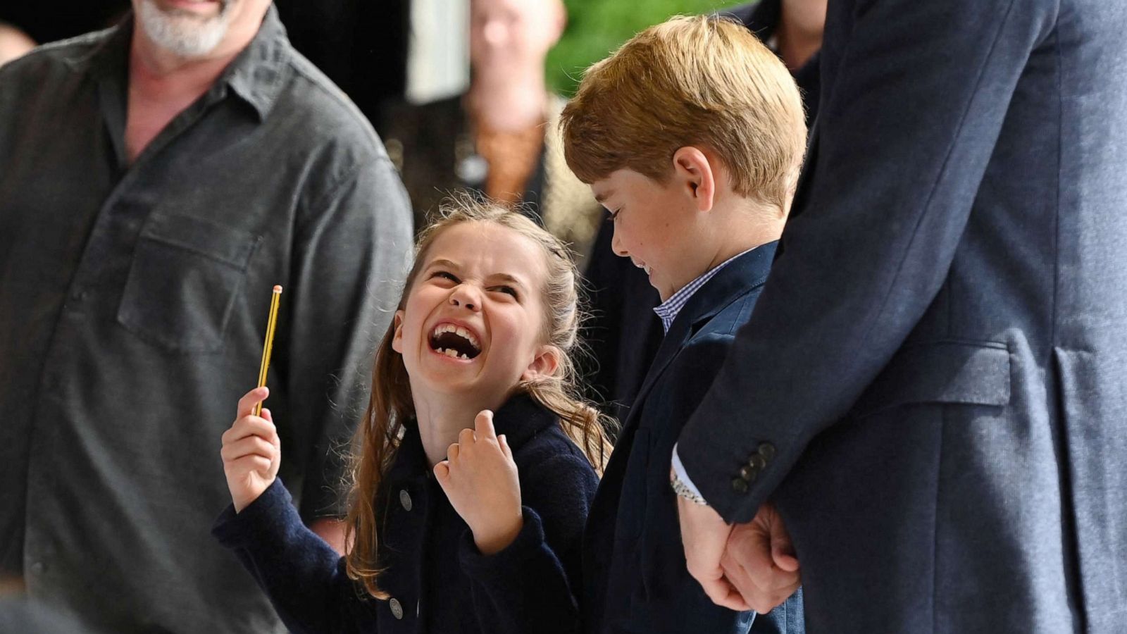 PHOTO: Princess Charlotte laughs as she conducts a band next to her brother Prince George during their visit to Cardiff Castle as part of the royal family's tour for Queen Elizabeth's Platinum Jubilee celebrations in Cardiff, Wales, Britain, June 4, 2022.