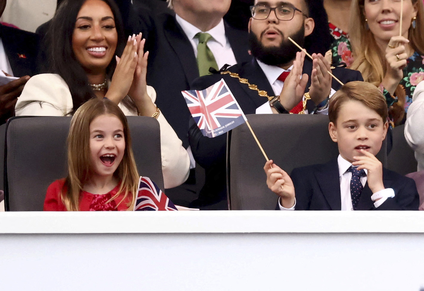 PHOTO: Prince George, right, and Princess Charlotte watch the Platinum Jubilee concert taking place in front of Buckingham Palace, London, June 4, 2022.