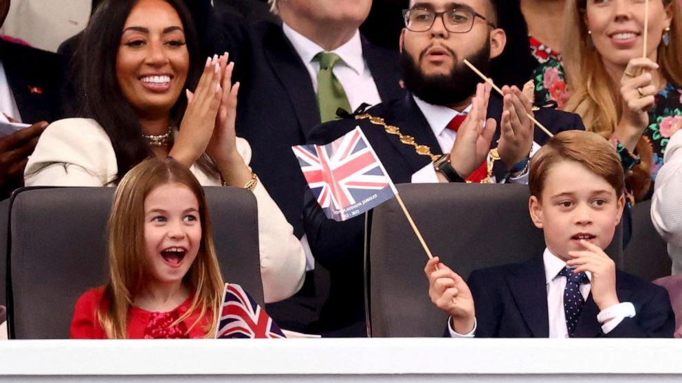 PHOTO: Prince George, right, and Princess Charlotte watch the Platinum Jubilee concert taking place in front of Buckingham Palace, London, June 4, 2022.