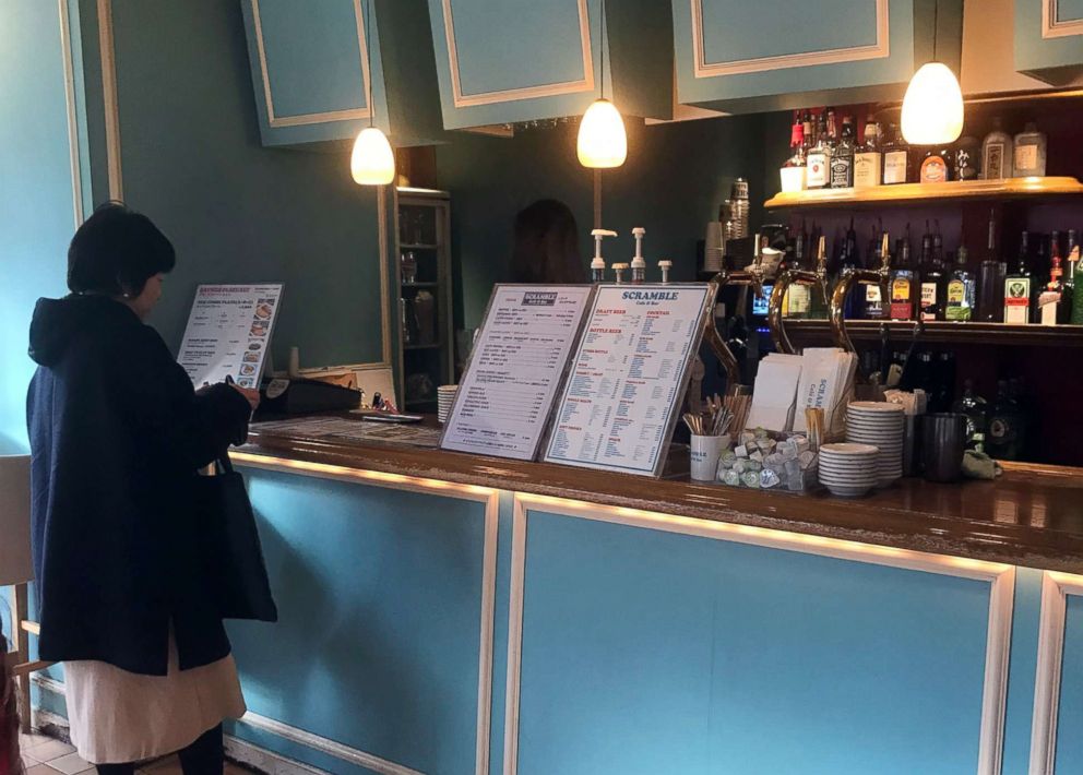 PHOTO: A woman stands at the counter of the Scramble Cafe & Bar in Tokyo, Jan. 31, 2019.