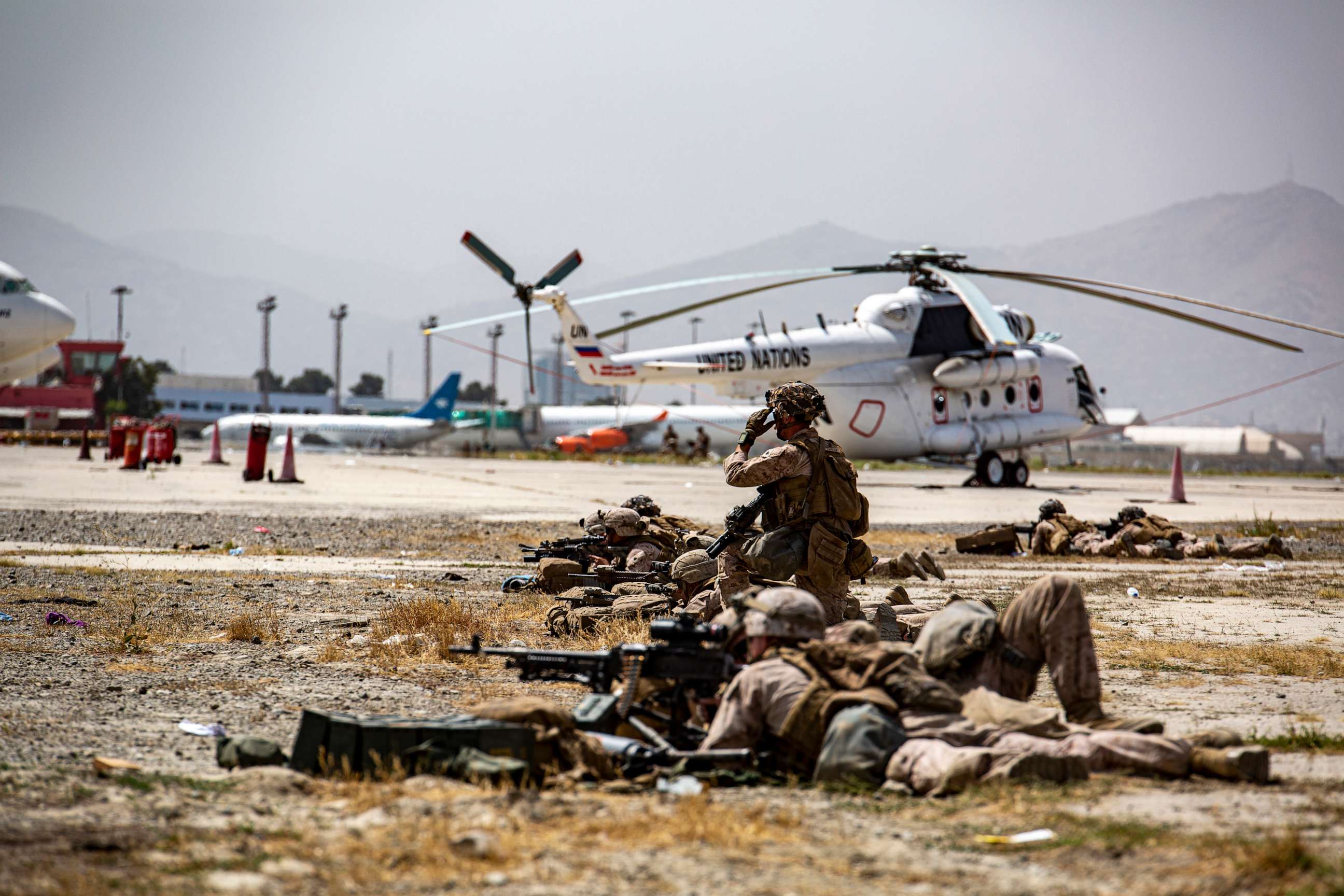 PHOTO: In this image provided by the U.S. Marine Corps, Marines assigned to the Special Purpose Marine Air Ground Task Force-Crisis Response-Central Command provide security at Hamid Karzai International Airport in Kabul, Afghanistan, on Aug. 18, 2021.