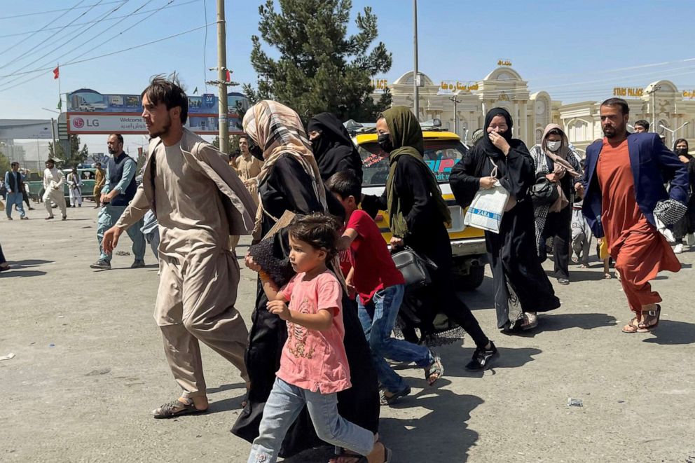 PHOTO: People try to get into Hamid Karzai International Airport in Kabul, Aug. 16, 2021.