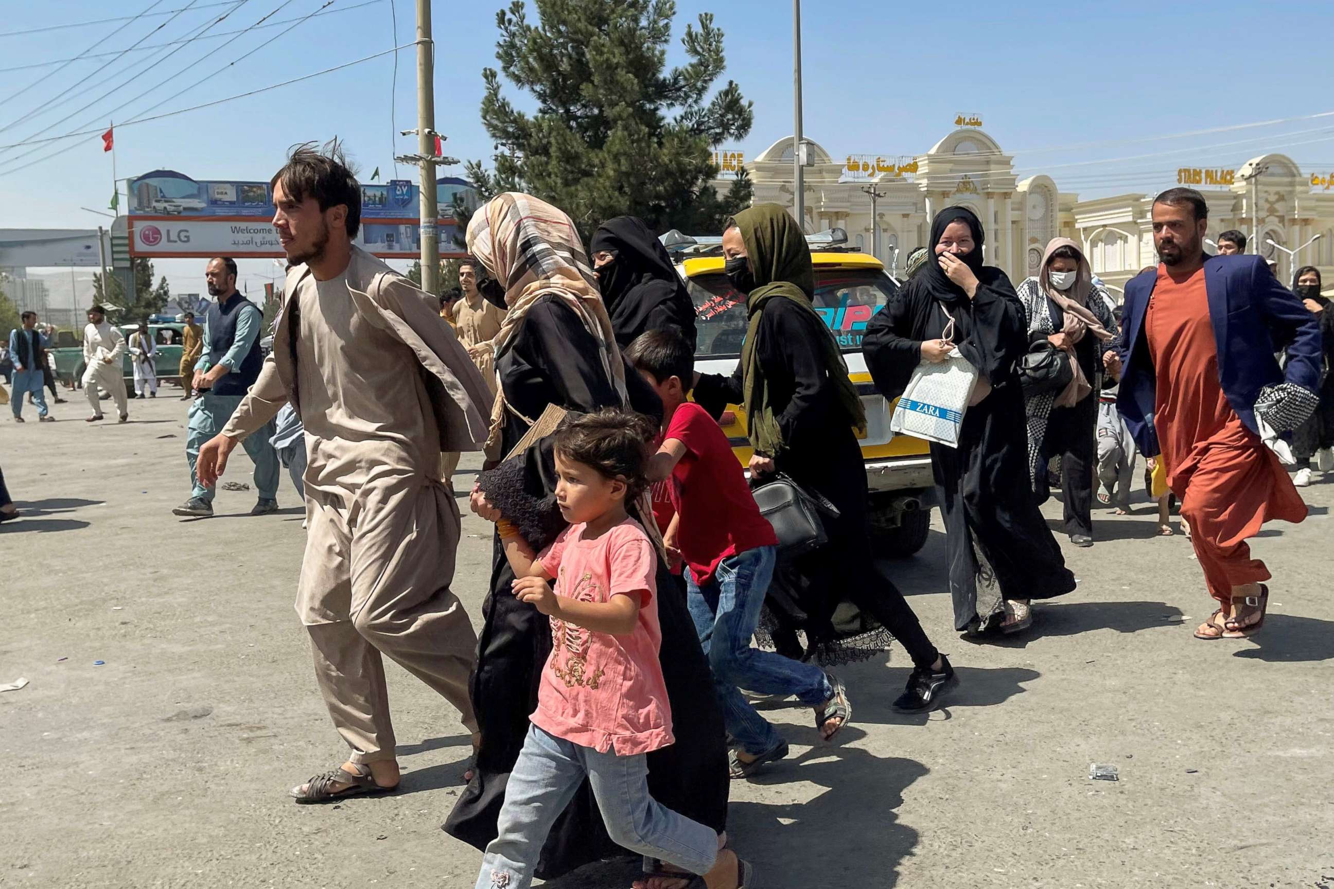 PHOTO: People try to get into Hamid Karzai International Airport in Kabul, Aug. 16, 2021.