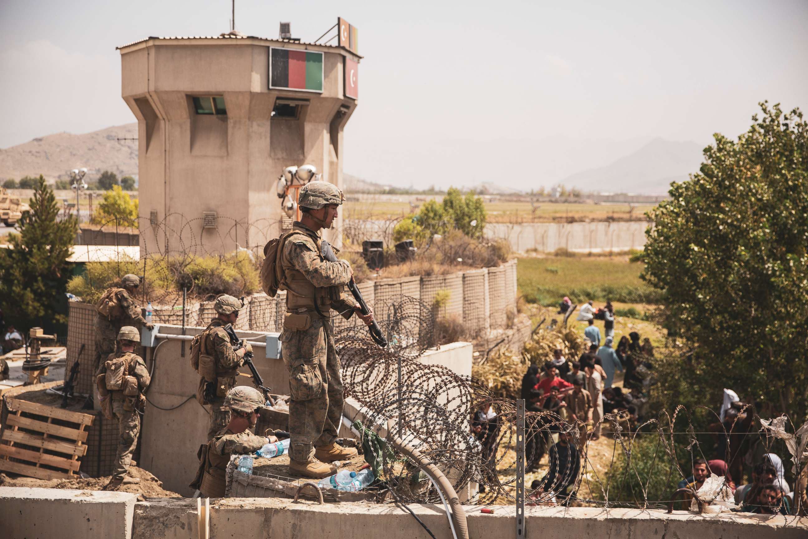 PHOTO: U.S. Marines assist with security at an Evacuation Control Checkpoint during an evacuation at Hamid Karzai International Airport, Kabul, Afghanistan, Aug. 20, 2021.