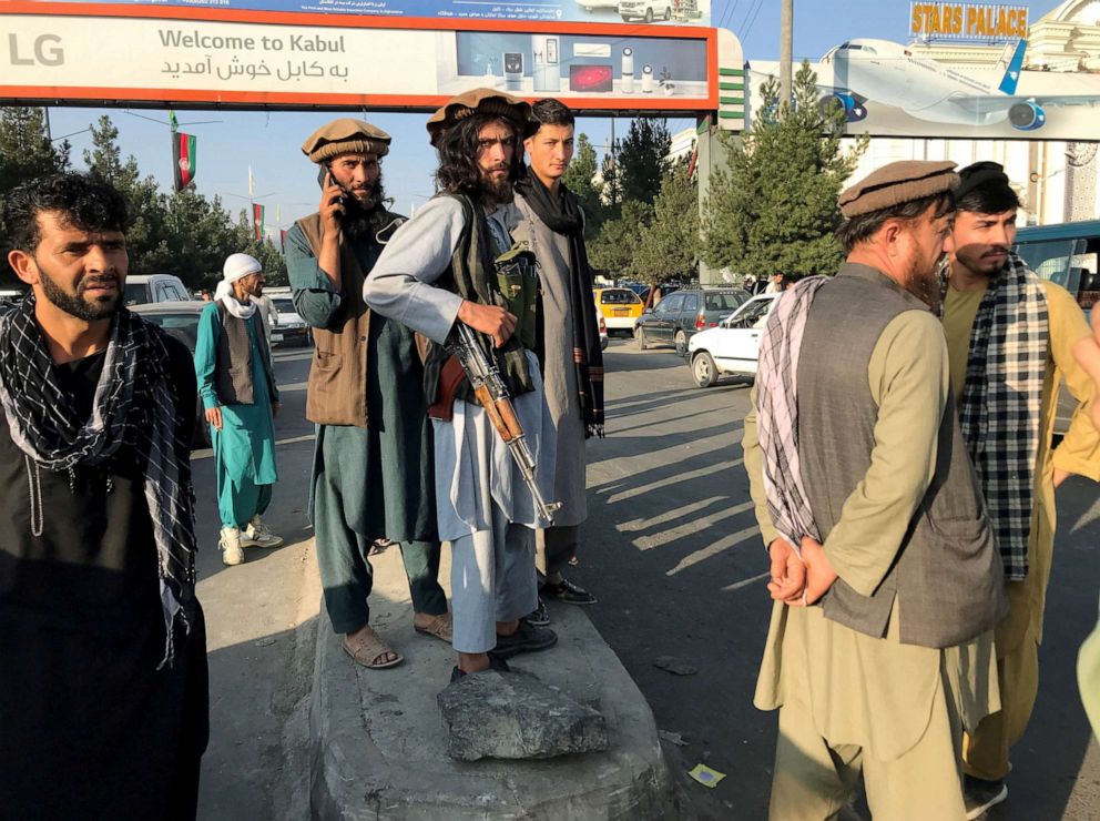 PHOTO: A member of Taliban stands outside Hamid Karzai International Airport in Kabul, Afghanistan, Aug. 16, 2021.