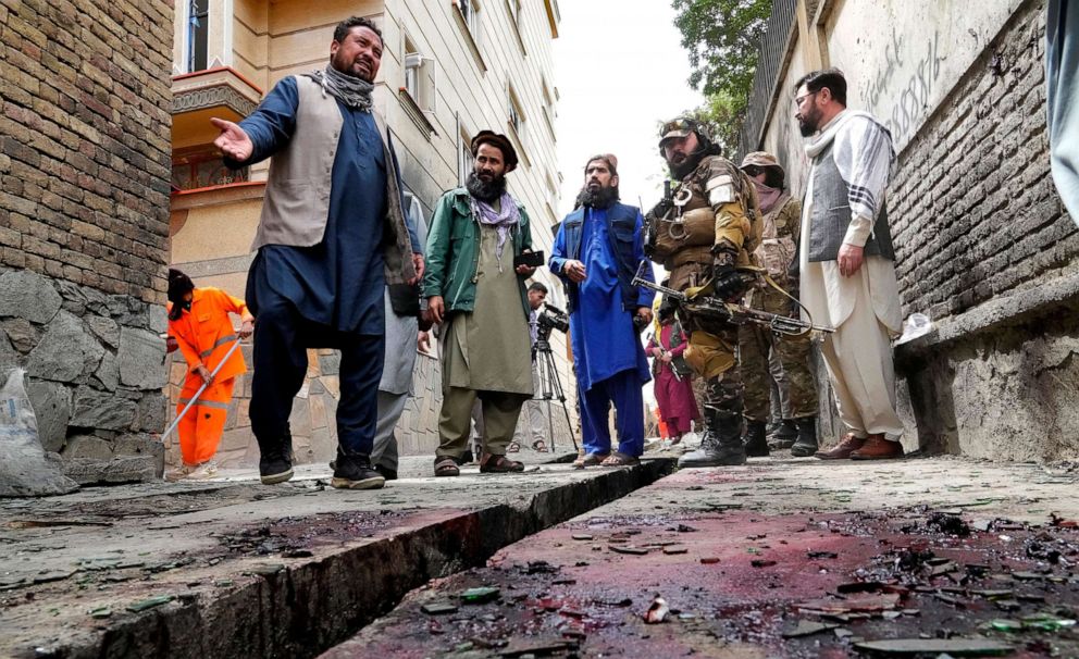 PHOTO: Taliban fighters stand guard at the site of an explosion near a school, in Kabul, Afghanistan, April 19, 2022.