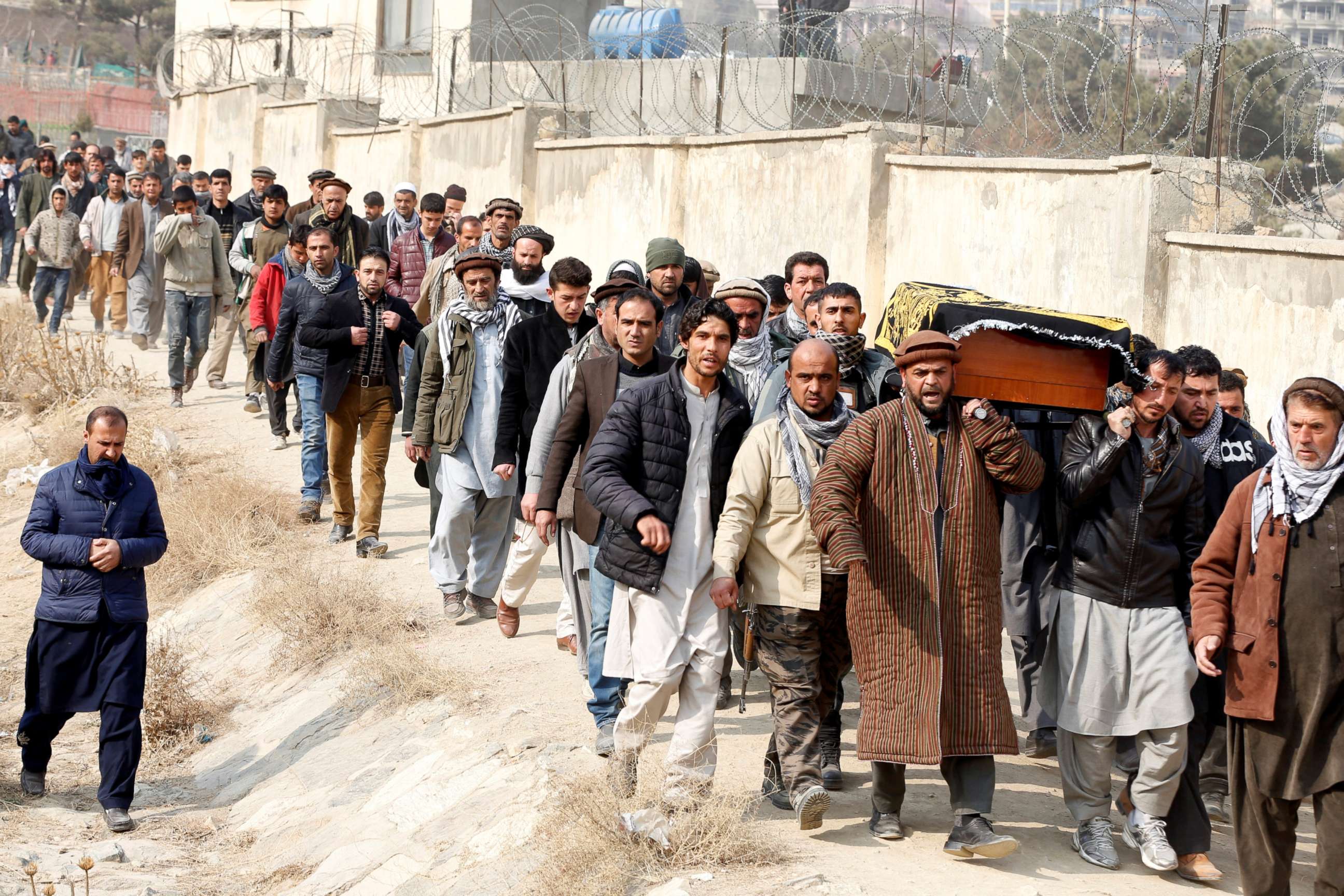PHOTO: Afghan men carry the coffin of one of the victims of yesterday's car bomb attack at in Kabul, Afghanistan, Jan. 28, 2018.