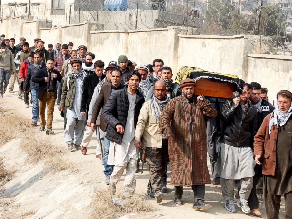 PHOTO: Afghan men carry the coffin of one of the victims of yesterdays car bomb attack at in Kabul, Afghanistan, Jan. 28, 2018.