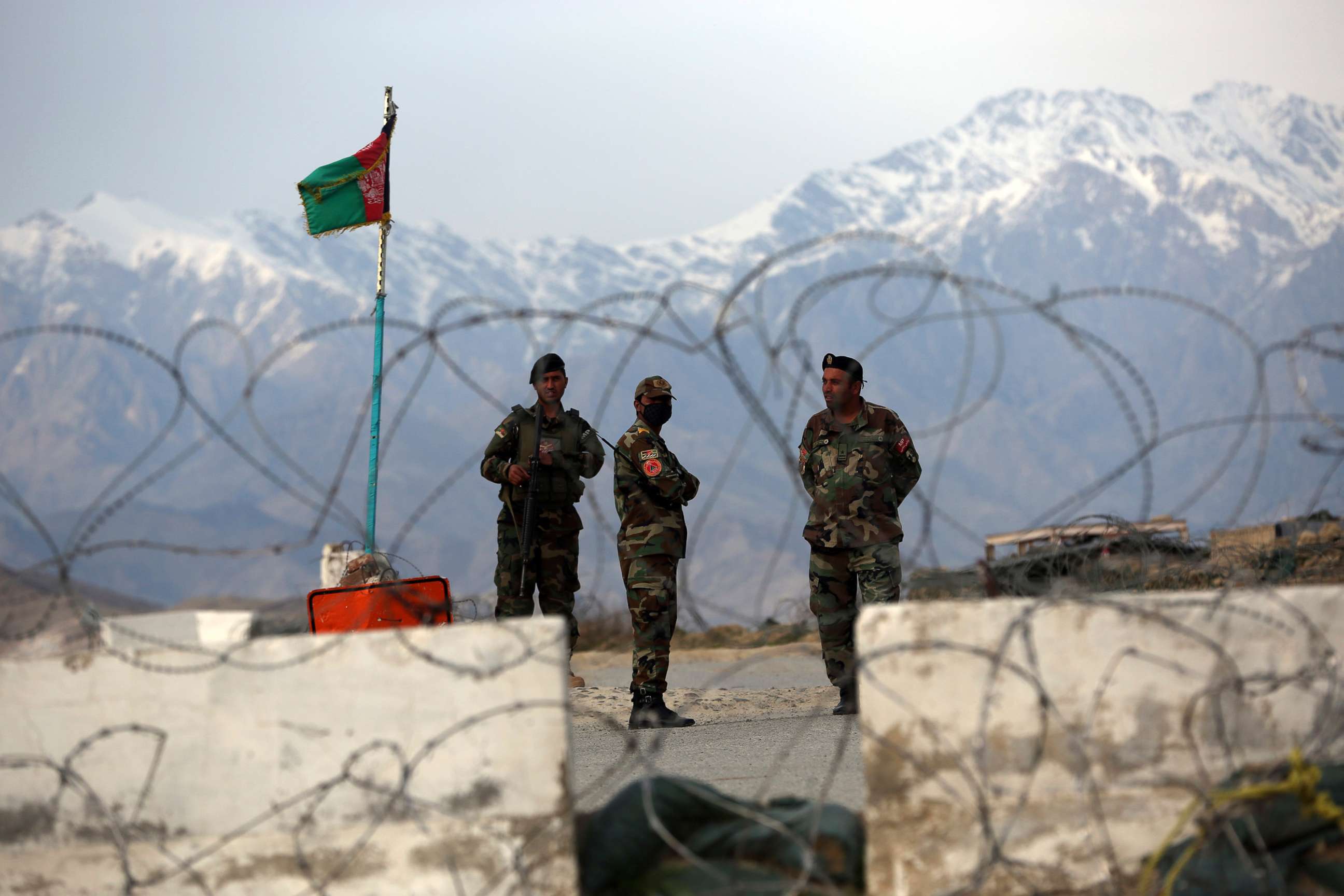 PHOTO: Afghan National Army soldiers stand guard at a checkpoint near the Bagram base in northern Kabul, April 8, 2020.