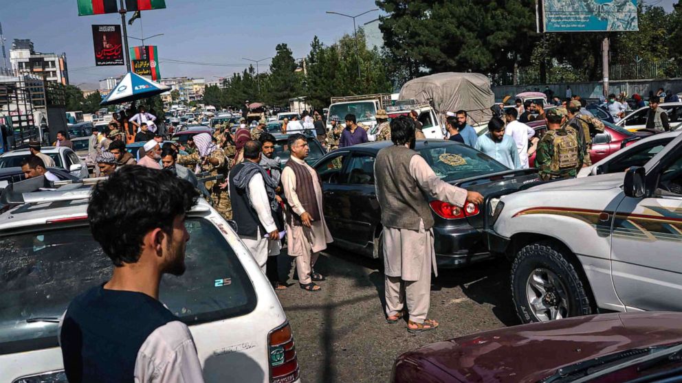 PHOTO: Motorists end up in a traffic grid lock as Afghans rush to safety with the uncertainty and rumor swirling that Taliban enter the city and take over, in Kabul, Afghanistan, Aug. 15, 2021.