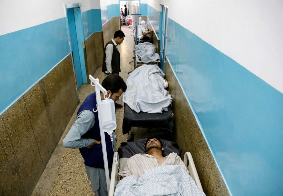 PHOTO: Injured men receive treatment in the hospital after sustaining wounds from a blast at a wedding hall in Kabul, Afghanistan, on Saturday, Aug. 18, 2019.