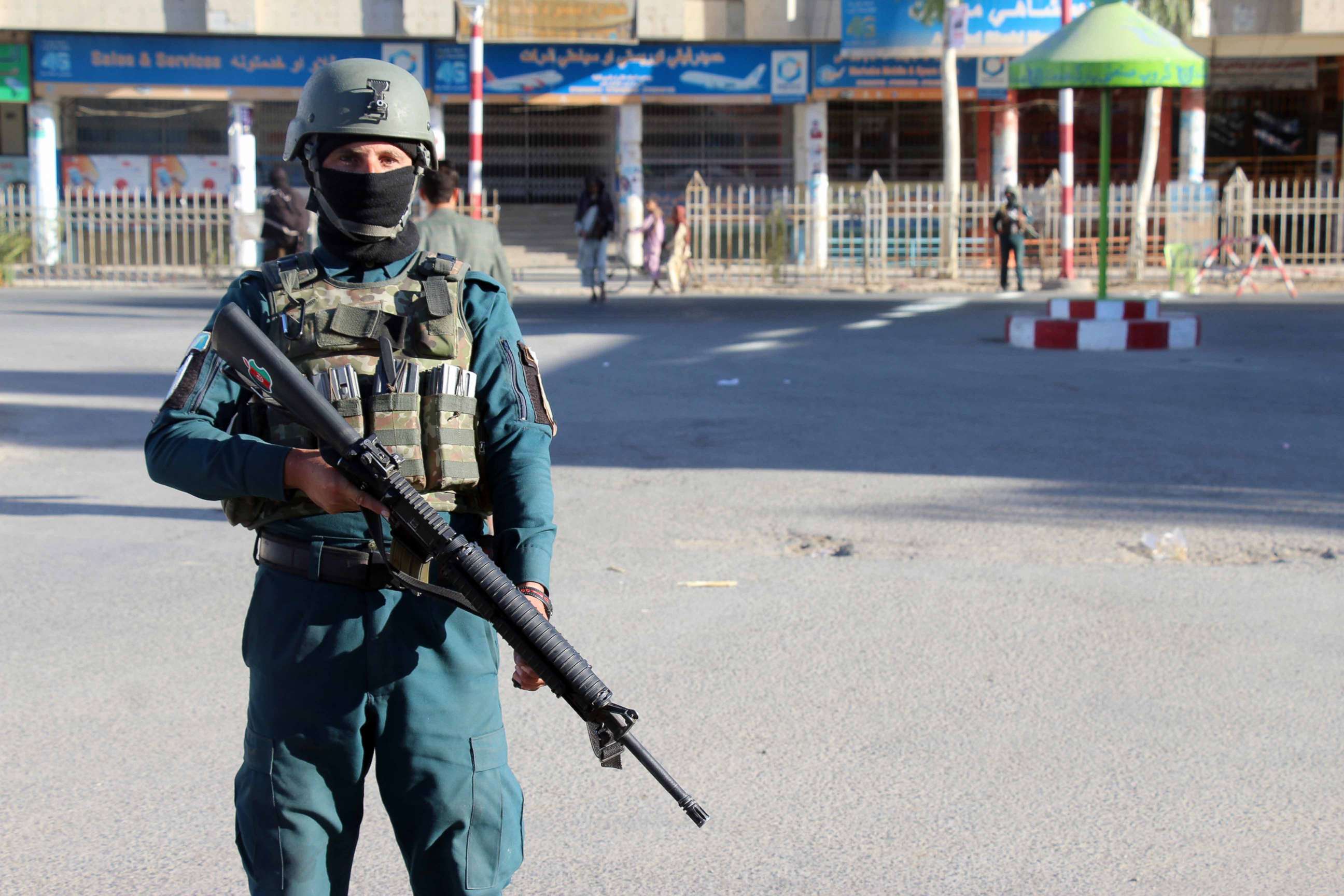 PHOTO: Afghan security officials stand guard on a road as security has been intensified a day after a Taliban militant killed General Abdul Razzaq Dawood, an Afghan Police commander, in Kandahar, Afghanistan, Oct. 19, 2018.