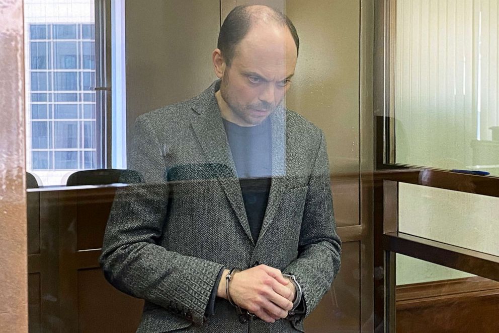 PHOTO: Russian opposition figure Vladimir Kara-Murza, who is accused of treason and spreading "false" information about the Russian army, stands inside a defendants' cage during his sentencing at the Moscow City Court in Moscow on April 17, 2023.