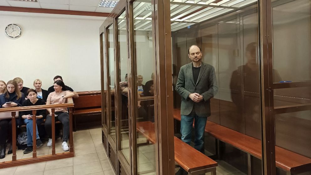 PHOTO: Russian opposition figure Vladimir Kara-Murza, who is accused of treason and spreading "false" information about the Russian army, stands inside a defendants' cage during his sentencing at the Moscow City Court in Moscow on April 17, 2023.
