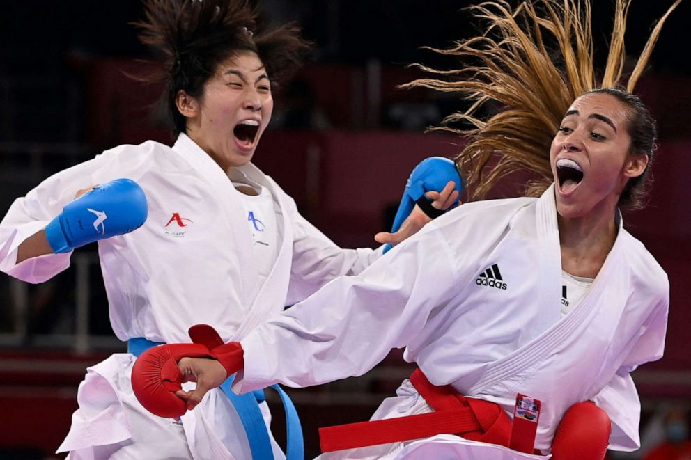 PHOTO: Japan's Mayumi Someya, left, competes against Venezuela's Claudymar Garces Sequera in the women's kumite -61kg elimination round of the karate competition during the Tokyo 2020 Olympic Games at the Nippon Budokan in Tokyo on Aug. 6, 2021.