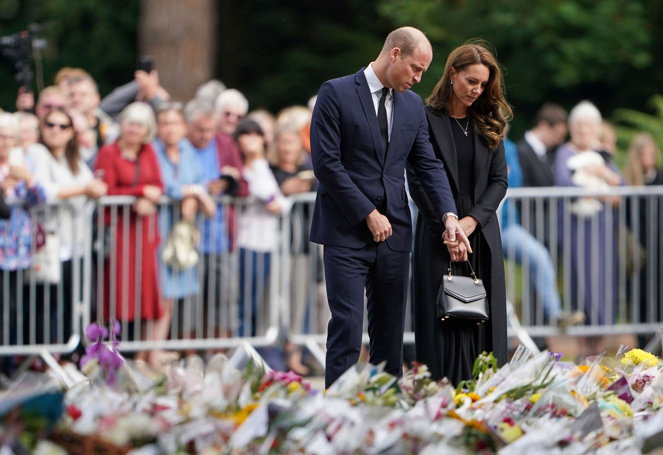 PHOTO: Prince William and the Princess of Wales view floral tributes to late Queen Elizabeth II left by members of the public at the gates of Sandringham House in Norfolk, Sept. 15, 2022.