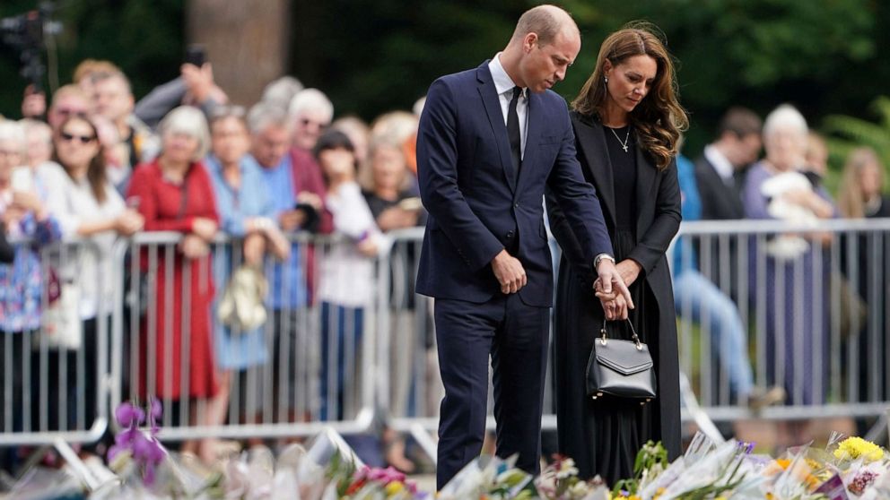 PHOTO: Prince William and the Princess of Wales view floral tributes to late Queen Elizabeth II left by members of the public at the gates of Sandringham House in Norfolk, Sept. 15, 2022.