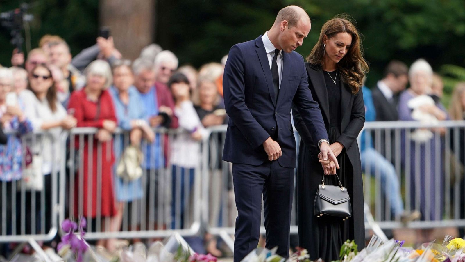 PHOTO: Prince William and the Princess of Wales view floral tributes to late Queen Elizabeth II left by members of the public at the gates of Sandringham House in Norfolk, Sept. 15, 2022.