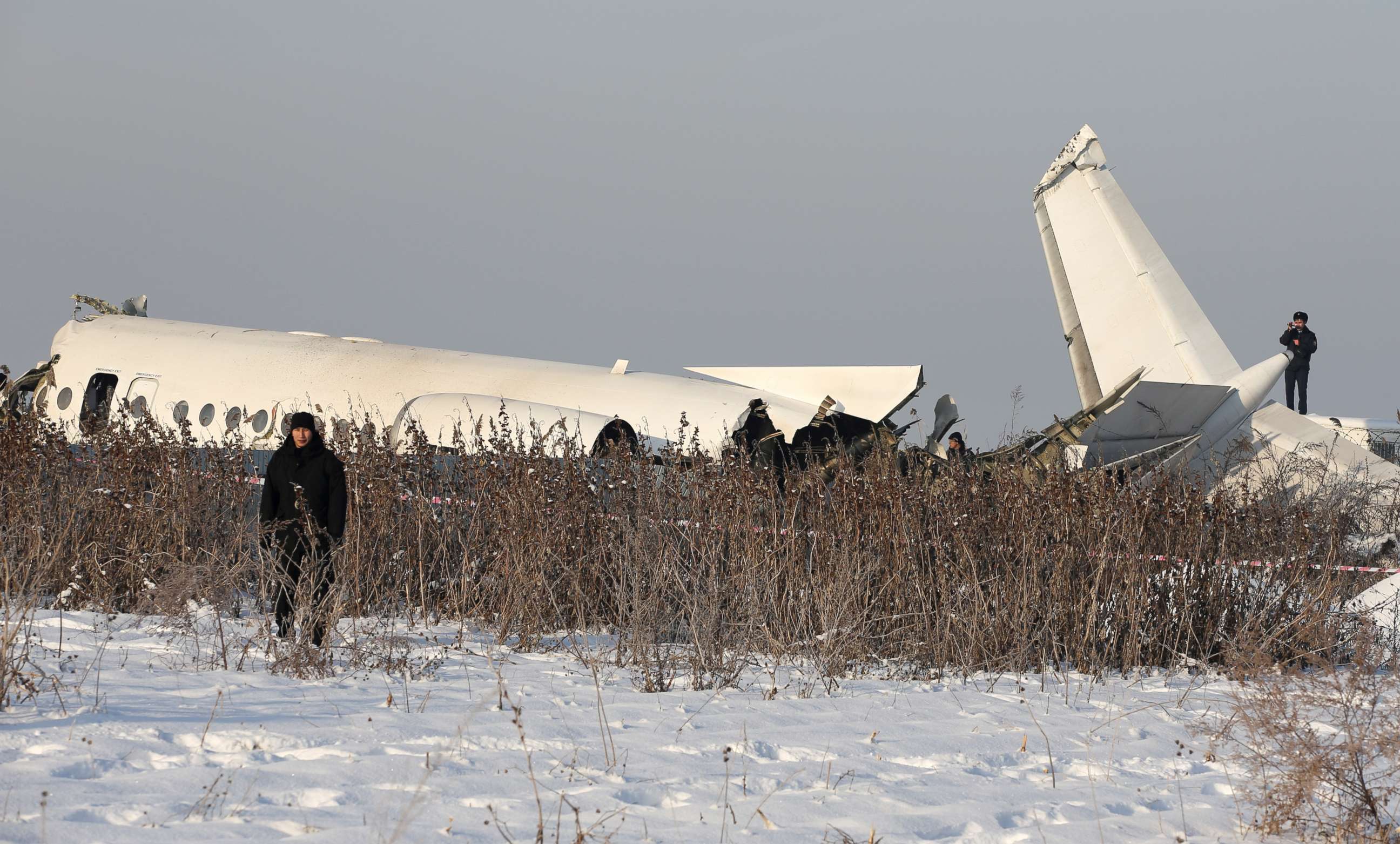 PHOTO: Emergency and security personnel are seen at the site of a plane crash near Almaty, Kazakhstan, December 27, 2019. 