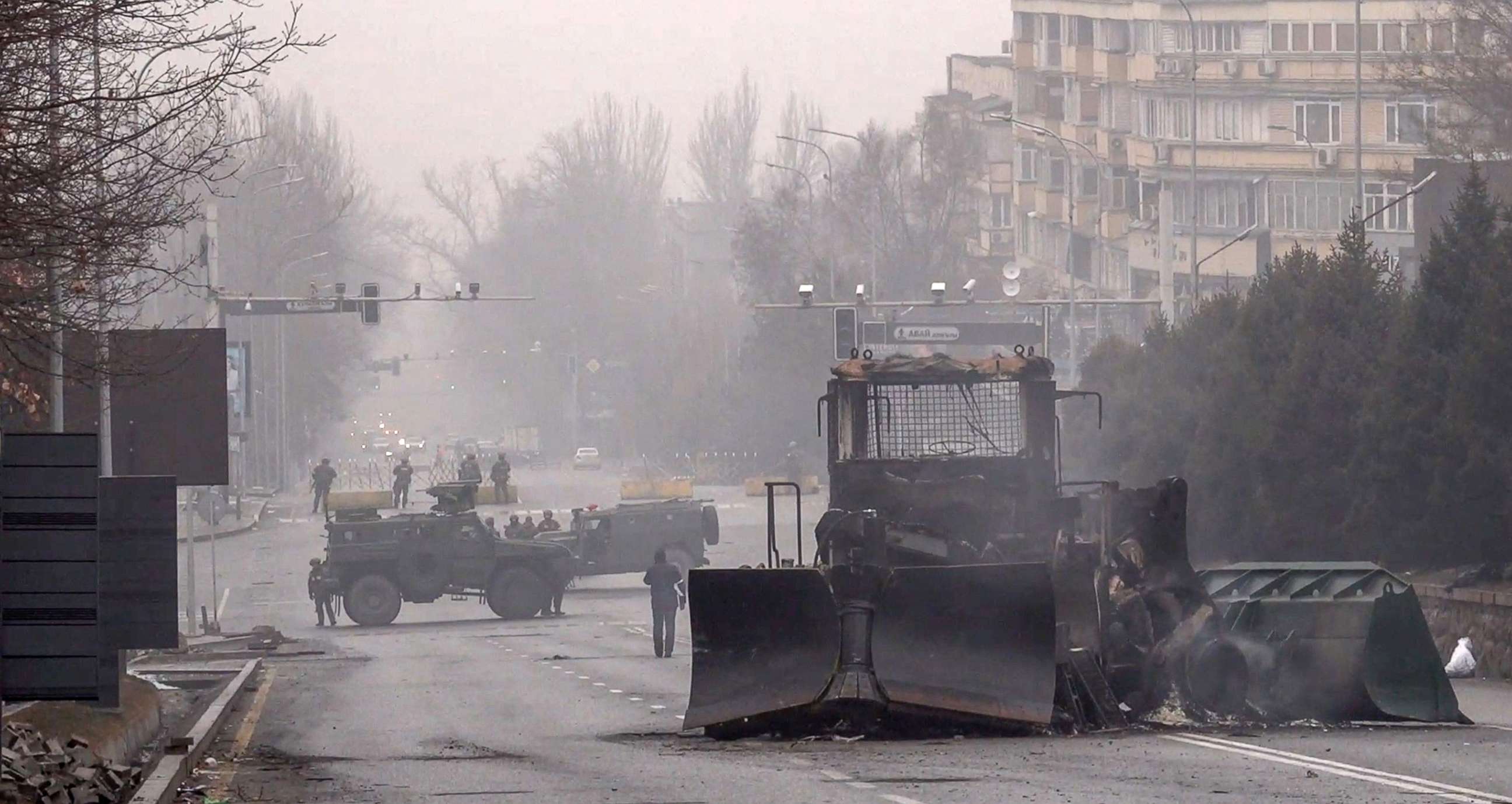 PHOTO: Servicemen and their military vehicles block a street in central Almaty, Kazakhstan, Jan. 7, 2022, as violence erupted following protests over hikes in fuel prices. 