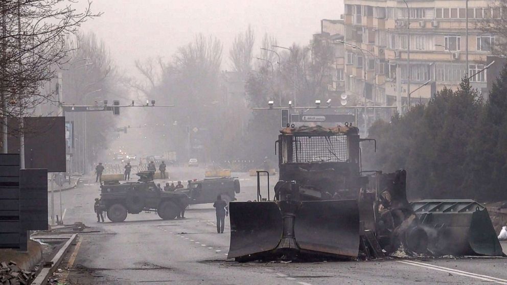 PHOTO: Servicemen and their military vehicles block a street in central Almaty, Kazakhstan, Jan. 7, 2022, as violence erupted following protests over hikes in fuel prices. 